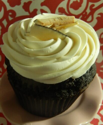 Chocolate fudge cupcake topped with coconut buttercream and organic shaved coconut